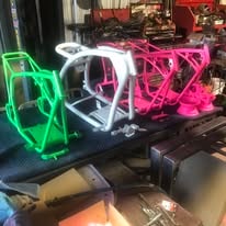 Powder coated motorcycle frames in the workshop