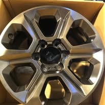 Machined alloy wheel rim in a box